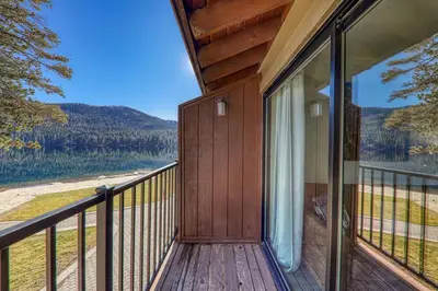 a balcony of a house with a view of a lake at Striking King Studio w/Partial Lake View #242 at Donner Lake Village in Truckee