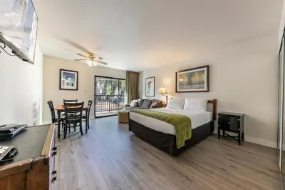 a hotel room with a bed and a table and chairs at King Studio 2nd Floor #234 at Donner Lake Village in Truckee