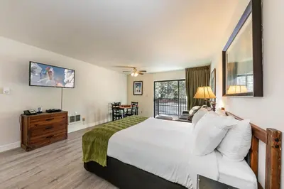 a bedroom with a large bed and a window at King Studio 2nd Floor #234 at Donner Lake Village in Truckee