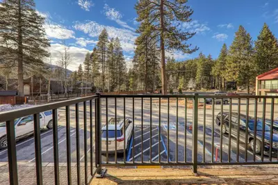 a fence with a car parked in a parking lot at King Studio 2nd Floor #234 at Donner Lake Village in Truckee