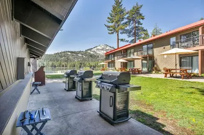 a row of trash cans sitting outside of a building at Charming Queen Studio Deluxe w/Balcony #233 at Donner Lake Village in Truckee