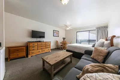 a living room with a couch and a tv at Cozy Studio #226 at Donner Lake Village in Truckee