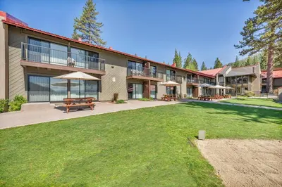 a large building with a lawn in front of it at Cozy Studio w/Kitchen #112 at Donner Lake Village in Truckee