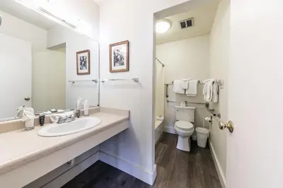 a white bathroom with a sink and a toilet at Homey 1st Floor Studio #135 at Donner Lake Village in Truckee