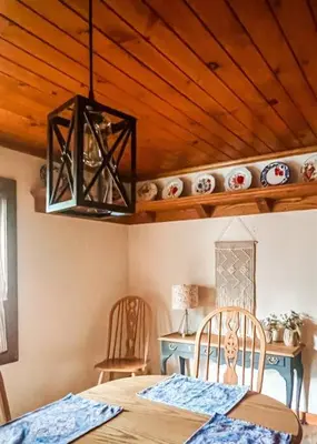 a dining room with a table and a chandelier at Twain Harte Lake, pool/hot tub, by skiing/Yosemite in Twain Harte