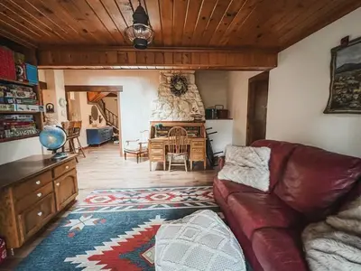 a living room with a couch and a table at Twain Harte Lake, pool/hot tub, by skiing/Yosemite in Twain Harte