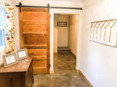 a hallway with a wooden door in a room at Twain Harte retreat w/ lake access, ski/Yosemite in Twain Harte