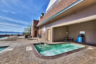 a swimming pool in front of a building at Lakeland Village 620 - Beachfront Bliss in South Lake Tahoe