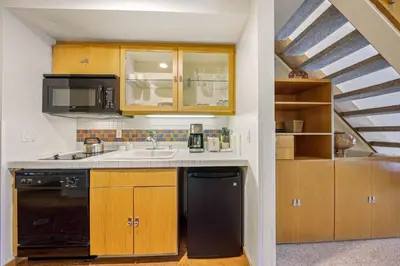 a kitchen with a sink and a stove at Palisades Tahoe Lodge Rentals Studio Loft #307 in Olympic Valley