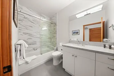 a bathroom with a shower and a toilet and a sink at Palisades Tahoe Lodge Rentals Premium Two Bedroom #805 in Olympic Valley