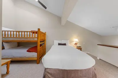 a bedroom with a bunk bed and a bunk bedouble at Palisades Tahoe Lodge Rentals Premium Studio Loft #313 in Olympic Valley