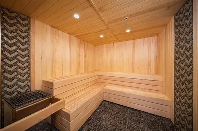 a large wooden sauna with a bench in it at Palisades Tahoe Lodge Rentals Two Bedroom #422 in Olympic Valley