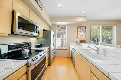 a kitchen with a stove and a sink at Palisades Tahoe Lodge Rentals Two Bedroom #512 in Olympic Valley
