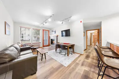 a living room with a couch and a table at Palisades Tahoe Lodge Rentals Two Bedroom #705 in Olympic Valley
