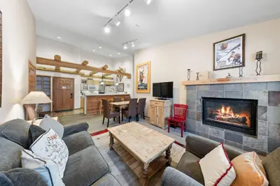 a living room with a couch and a fireplace at Palisades Tahoe Lodge Rentals Two Bedroom #800 in Olympic Valley
