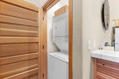 a laundry room with a washer and dryer and a sink at Palisades Tahoe Lodge Rentals Two Bedroom #809 in Olympic Valley