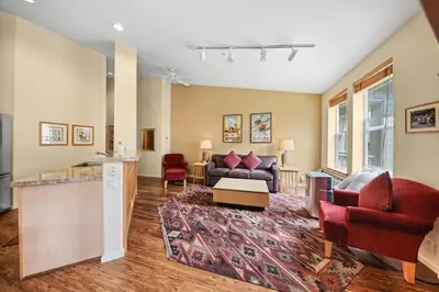 a living room with a couch and chairs and a table at Palisades Tahoe Lodge Rentals Two Bedroom #813 in Olympic Valley