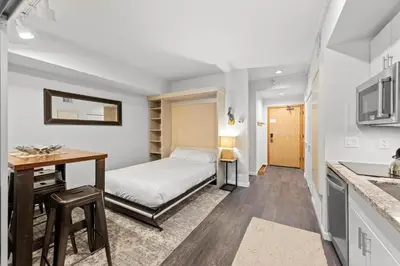 a bedroom with a bed and a desk at Palisades Tahoe Lodge Rentals Premium Studio #227 in Olympic Valley