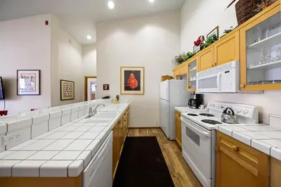 a kitchen with white counters and white appliances at Palisades Tahoe Lodge Rentals Two Bedroom #814 in Olympic Valley