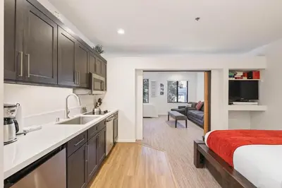 a kitchen and living room with a bed in a room at Palisades Tahoe Lodge Rentals Premium Studio #252 in Olympic Valley