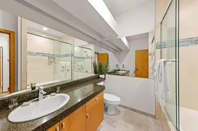 a bathroom with a sink and a toilet and a shower at Palisades Tahoe Lodge Rentals Studio #144 in Olympic Valley