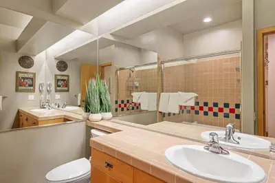 a bathroom with two sinks and a toilet at Palisades Tahoe Lodge Rentals Studio #151 in Olympic Valley