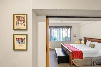 a bedroom with a bed and a window at Palisades Tahoe Lodge Rentals Studio #154 in Olympic Valley