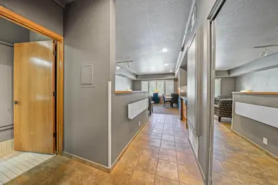 an office hallway with a door leading to a room at Palisades Tahoe Lodge Rentals Studio #225 in Olympic Valley