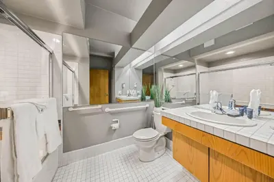 a bathroom with a sink and a toilet and a tub at Palisades Tahoe Lodge Rentals Studio #225 in Olympic Valley