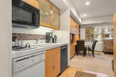 a kitchen with a sink and a stove top oven at Palisades Tahoe Lodge Rentals Studio #234 in Olympic Valley