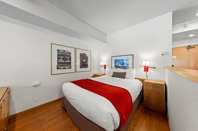 a bedroom with a large bed in a room at Palisades Tahoe Lodge Rentals Studio #229 in Olympic Valley