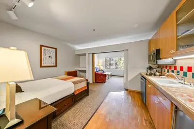 a hotel room with a bed and a sink at Palisades Tahoe Lodge Rentals Studio #246 in Olympic Valley