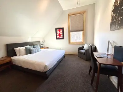 a bedroom with a large bed and a desk and a desk at Tahoe Star Hotel in Truckee