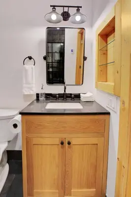 a bathroom with a sink and a mirror at Slope Side Studio in Northstar Village! in Truckee