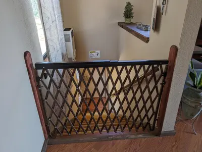 a wooden stair railing in a room with a window at Rustic Rooms Barn Loft (Upstairs Studio Apartment) Near Kings Canyon & Sequoia National Parks in Squaw Valley