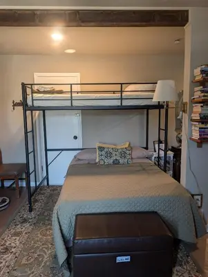 a bedroom with a bunk bed in a room at Rustic Rooms Barn Loft (Upstairs Studio Apartment) Near Kings Canyon & Sequoia National Parks in Squaw Valley