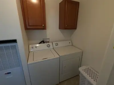 a laundry room with a washing machine and a washer at Rr-kenton Hs in June Lake