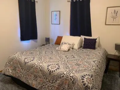 a bedroom with a large bed with pillows on it at Rr-june Lake Lodge in June Lake