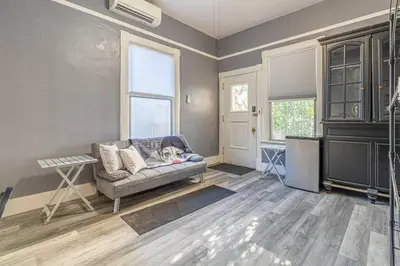 a living room with a dog laying on a couch at Rustic 3-Bedroom, 1.5-Bath Oasis by Downtown in Reno