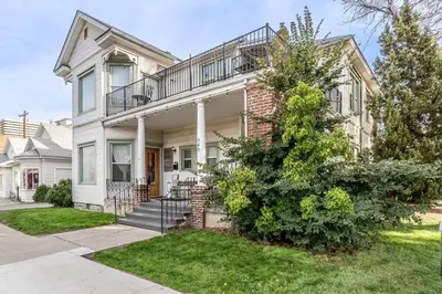 a house with a balcony on top of it at Rustic 3-Bedroom, 1.5-Bath Oasis by Downtown in Reno