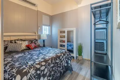 a bedroom with a bed and a book shelf at Rustic 3-Bedroom, 1.5-Bath Oasis by Downtown in Reno