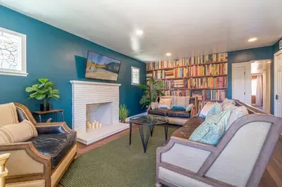 a living room with a couch and a fireplace at Reno Serenade: 3-Bed Urban Sanctuary in Reno