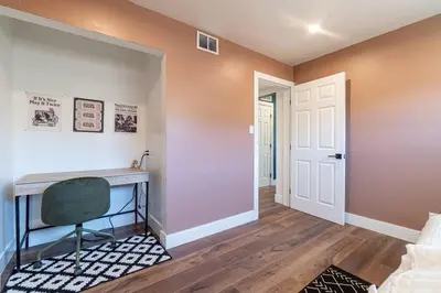 a home office with a desk and a door at Reno Serenade: 3-Bed Urban Sanctuary in Reno
