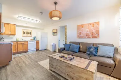 a living room with a couch and a table at Midtown Modern - Stylish 2BR Lodging in Reno in Reno