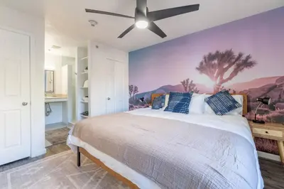 a bedroom with a large bed with a ceiling fan at Midtown Modern - Stylish 2BR Lodging in Reno in Reno