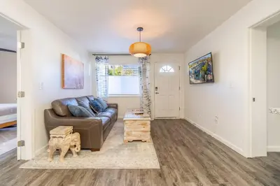 a living room with a couch and a table at Midtown Modern - Stylish 2BR Lodging in Reno in Reno