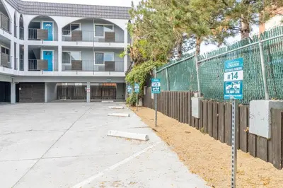 a parking lot in front of a building at Modern Haven: Chic Studio Getaway in Reno