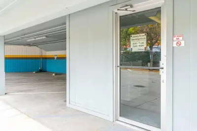 an open glass door of a parking garage at Modern Haven: Chic Studio Getaway in Reno
