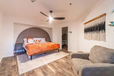 a bedroom with a bed and a couch at Stylish-Serene Midtown Getaway: Retreat for Two in Reno