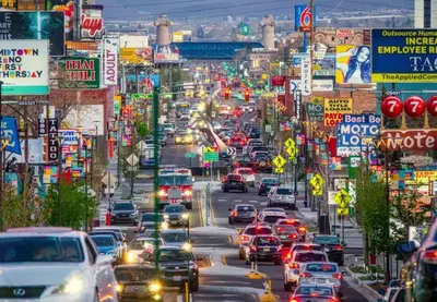 a busy city street filled with lots of cars at Stylish-Serene Midtown Getaway: Retreat for Two in Reno